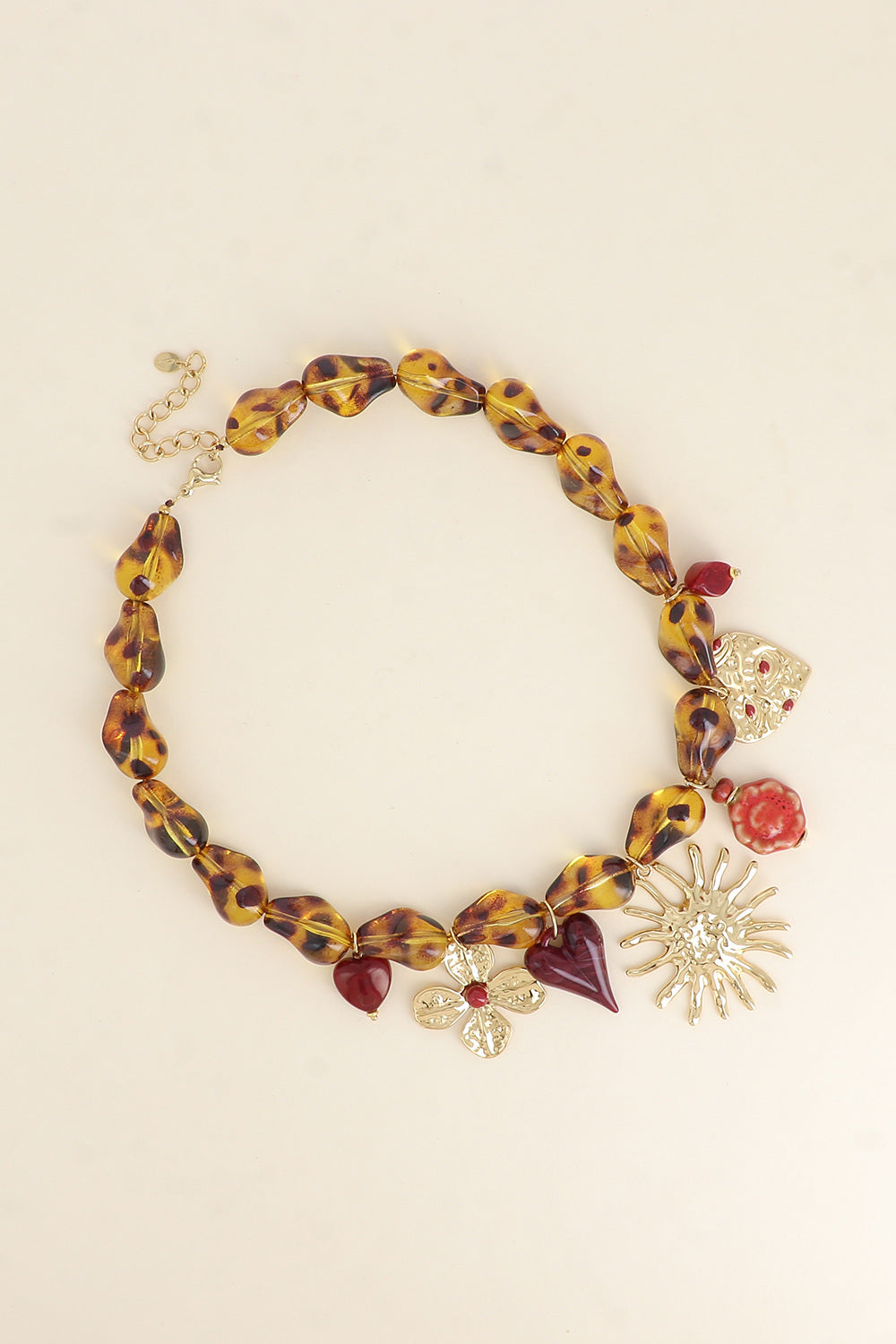 collier-sur-fil-perles-coeurs-soleil-martele-ceramique-emaillee-trefle_leopard_68e4da211746a.jpg